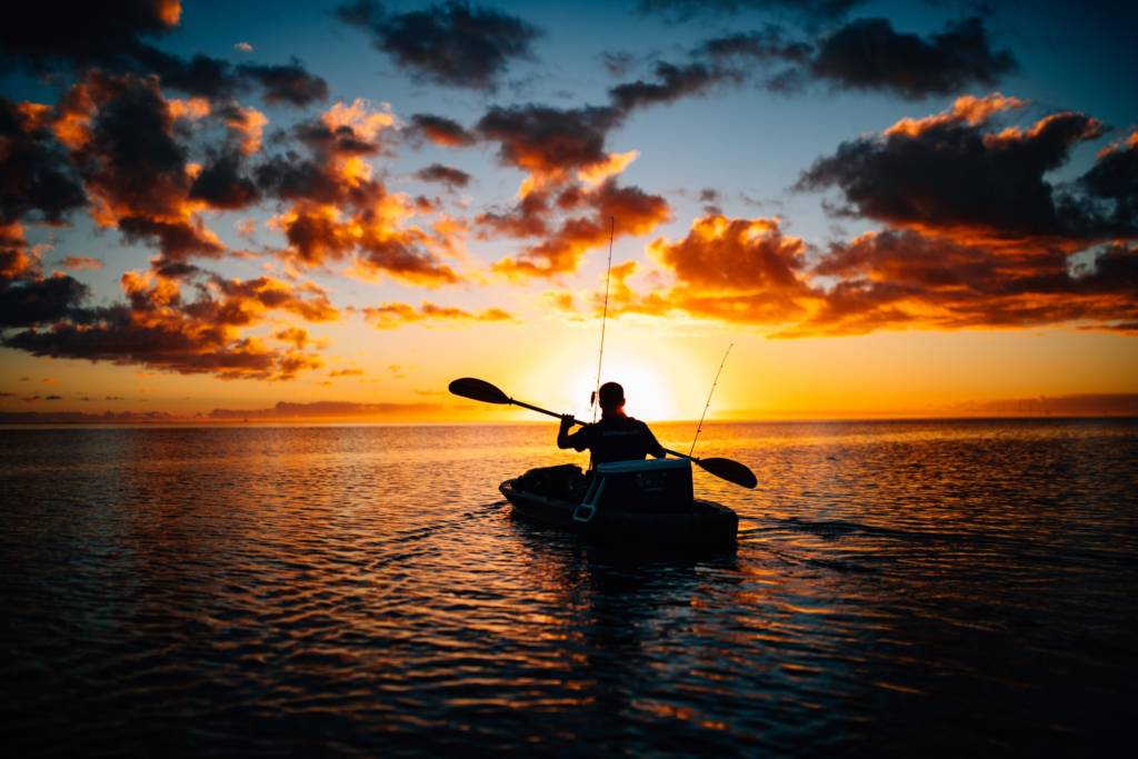 This image has an empty alt attribute; its file name is Fishing-on-a-kayak-in-the-sunset-1024x683.jpg