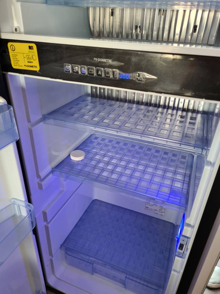 A camper van's fridge. RuuviTag is the best smart device in a camper van, as it can be used in many different use cases.