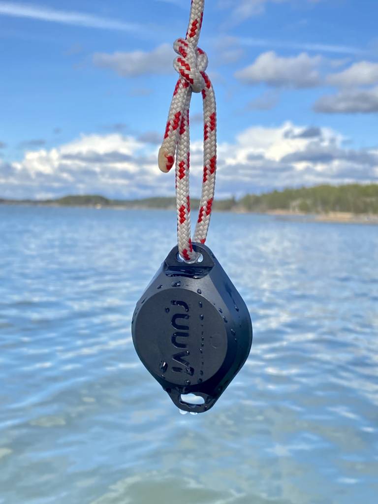 RuuviTag Pro 2in1 hanging from a rope on top of sea.