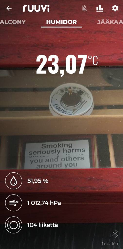 Screenshot from the Ruuvi mobile application. Temperature inside the humidor is 23,07 celsius degrees and humidity is 51,95% of relative humidity.