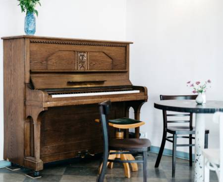 Piano in the corner of a room. Pianos conditions will stay good if they are in proper envirnoment